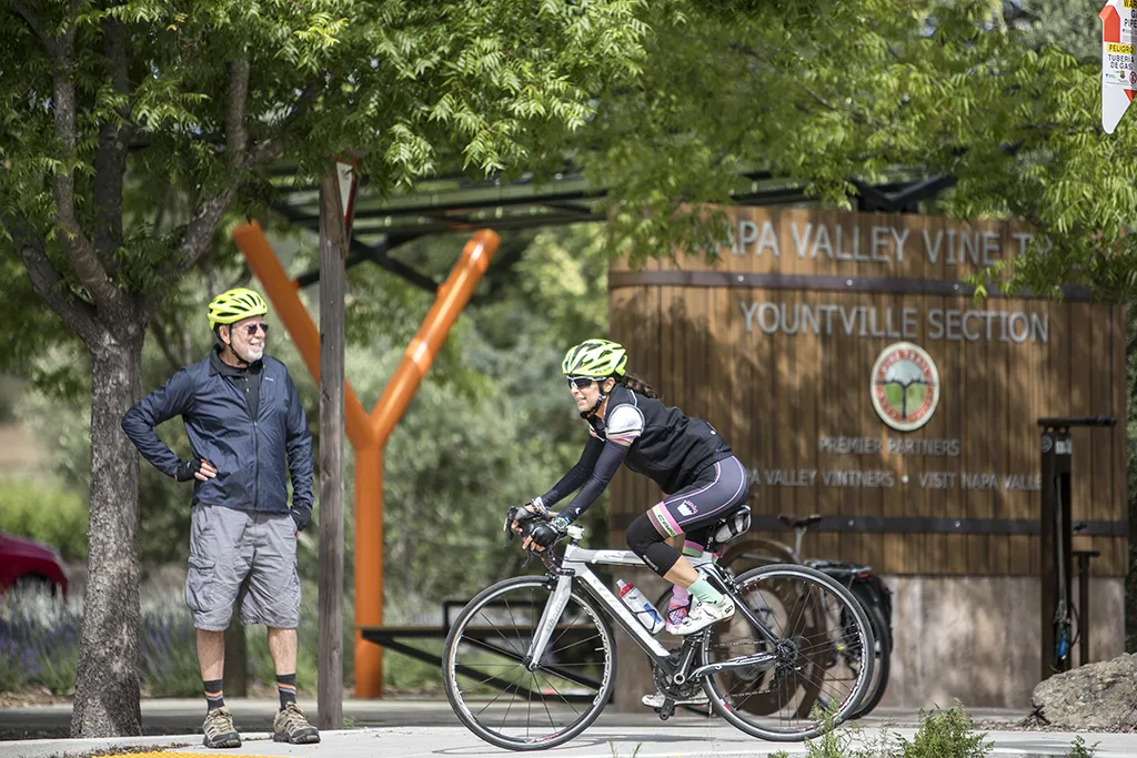 Cyclist utilizing the vine trail and getting off the road.